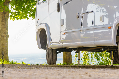 Tableau sur toile Camper with hydraulic leg in use. Rv levelling system