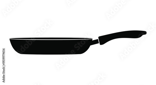 A stark black frying pan is shown in a clean minimalist profile silhouette high quality professional