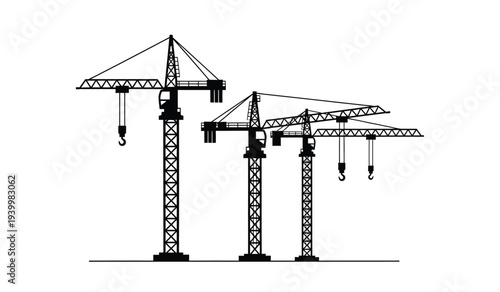 Three construction cranes standing in a row with hooks hanging down