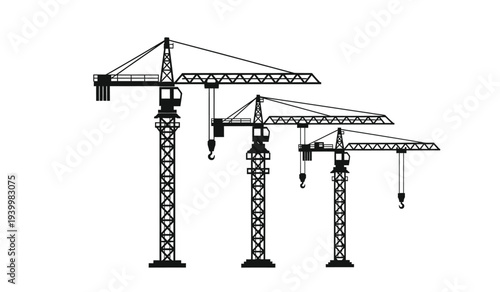 Three tower cranes in different stages of construction