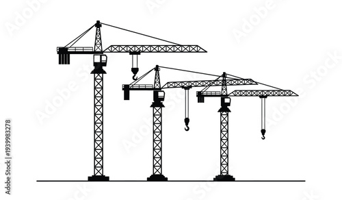 Three construction cranes standing in a row with hooks hanging down