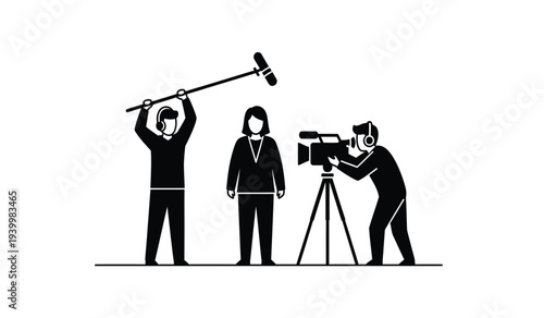 Film crew at work with cameraman director and clapper loader on set