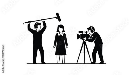 Film crew with cameraman and boom operator working together on set