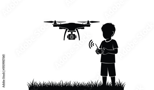 Young boy operating a drone with a remote control in a grassy field