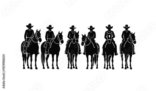 Group of cowboys on horseback silhouetted against a