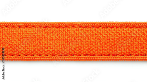 Close-up of a bright orange woven fabric strap with detailed stitching on a white background