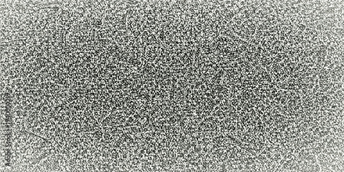 Abstract detailed close-up shot of a textured, mottled surface, creating a visual effect like a field of small granules.