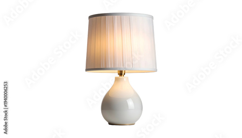 A modern table lamp featuring a white, teardrop-shaped base. A gold accent holds a pleated white shade illuminated with warm light