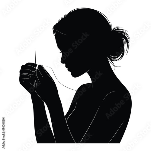 Silhouette of young woman threading needle with fine thread preparing for delicate hand sewing or embroidery work against transparent background