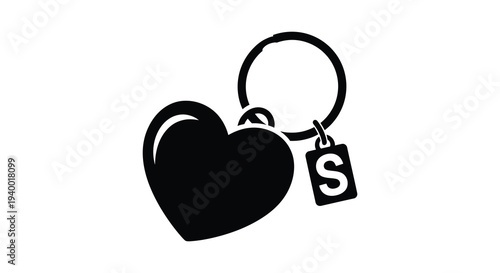 A striking black silhouette depicts a heart shaped keychain with an initial tag evoking themes of love and personalization
