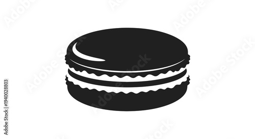 A striking black silhouette depicts a delicate french macaron with detailed layers and a glossy sheen silhouette