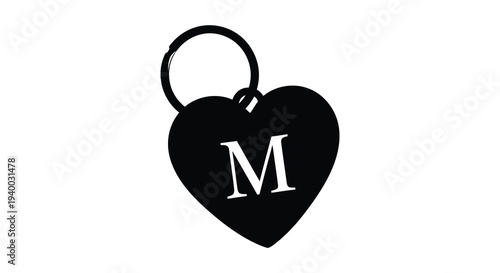 A striking black heart shaped keychain with a prominent initial m presented as a bold silhouette high quality professional