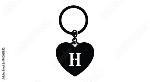A black keychain featuring a heart shaped pendant with the letter h displayed against a white background silhouette