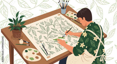 Artist painting botanical pattern on paper at desk with plants and art supplies