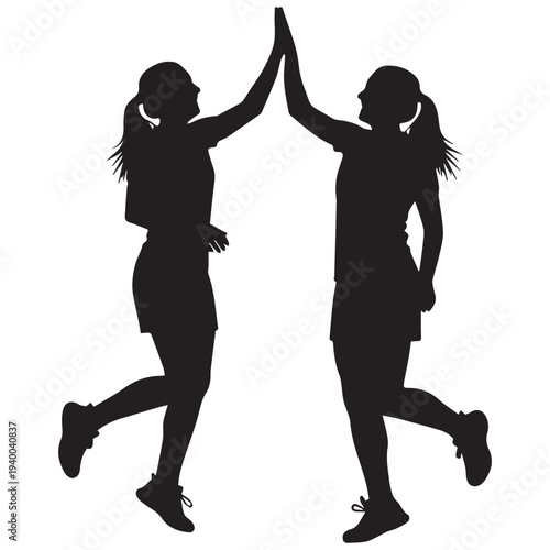 Two women in athletic wear giving high five in joyful celebration together