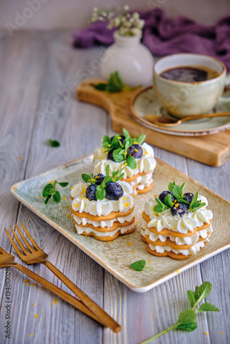 Homemade Honey Pastry Dessert with Whipped Cream, Blueberries and Mint