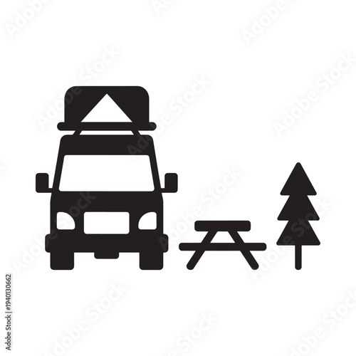 Simple black icon depicting a camper van picnic table and tree