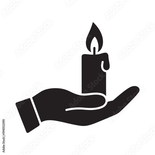 A black silhouette depicts a hand gently holding a lit candle