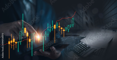Businessman using a digital tablet with glowing financial charts and candlestick graphs overlay. stock market analysis, investment strategy, business growth. finance, banking, global trading concept.