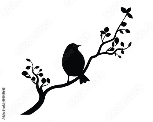 Black silhouette of a bird perched on a leafy tree branch