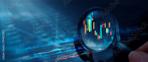 Magnifying glass over candlestick chart and digital financial diagram, Stock market data analysis and market research, investment strategy and business intelligence data analytics.