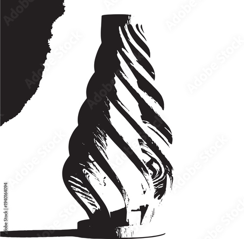 Sculpted vase in abstract silhouette with dramatic black and white contrast on textured background for modern home decor