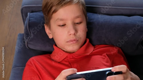  Boy Using Smartphone at Home