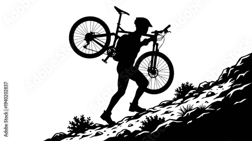 Man carrying mountain bike up rocky hill