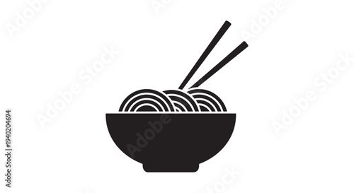 Bowl of Asian noodles with chopsticks resting above the steaming contents represents quick, savory international cuisine.