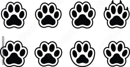 Vector illustration of various black paw print designs arranged in a grid format for graphic use