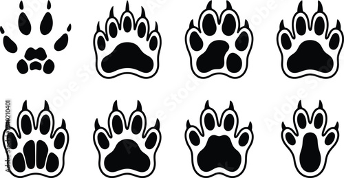 Set of eight unique black paw print icons in various styles and sizes for digital design use