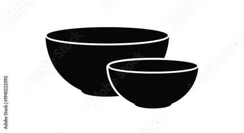 Two black bowls of varying sizes presented in a stark silhouette