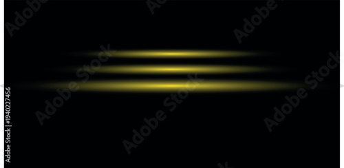 Blurry yellow horizontal light streaks on black background