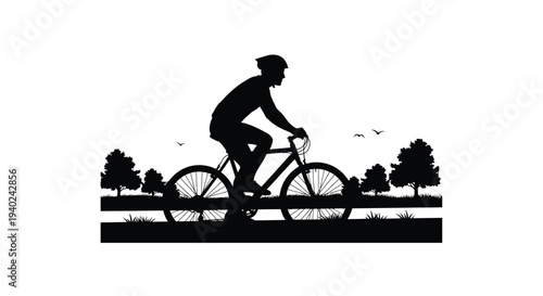 Cyclist riding a bicycle through a landscape a striking silhouette