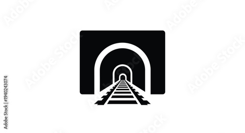 A receding railway track leading into a dark tunnel silhouette