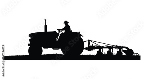 Farmer driving a vintage tractor in a field black silhouette