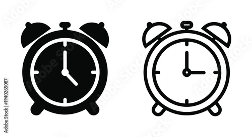 Two black alarm clocks displaying different times a simple silhouette