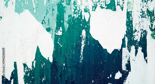 Abstract textured wall with peeling paint in shades of teal and white