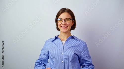 Beautiful girl rejoicing over new glasses for vision happy young woman with new eyeglasses successful purchase joy clear sight celebration positive emotions studio