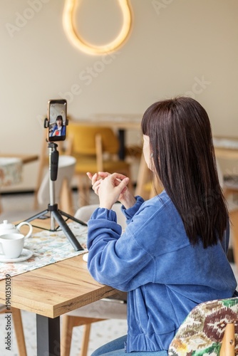 Woman Recording Vlog Video on Smartphone Tripod