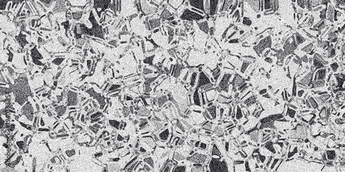Abstract monochrome background with a mosaic-like pattern of irregular geometric shapes and a grainy texture overlay