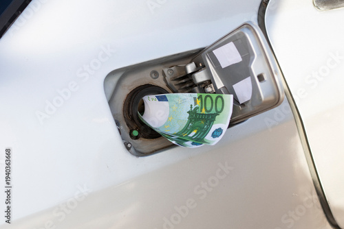 People pay for fuel amid rising gas prices and increased demand at gas stations in urban areas