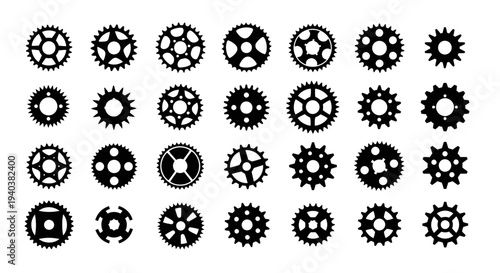 Organized grid pattern of various black mechanical gears and cogs, symbolizing industrial systems, isolated on a white background.