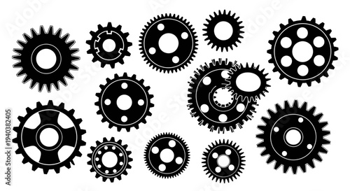 Assortment of black mechanical gears and cogs, symbolizing industry and engineering, isolated on a white background.