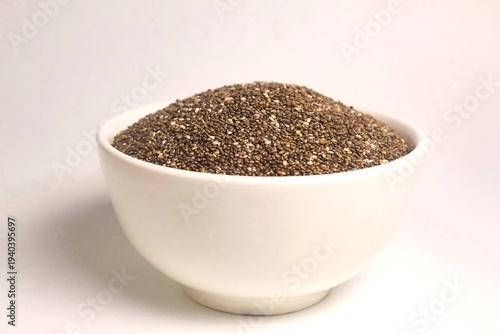 bowl of chia seeds isolated on white background
