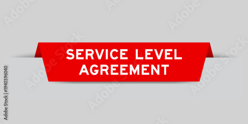 Red color inserted label with word service level agreement on gray background