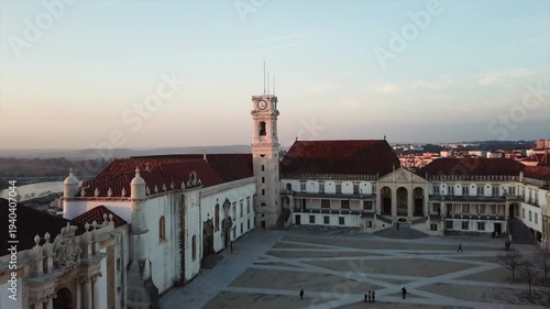 Cinematic aerial drone panorama of Coimbra, Portugal — historic European cityscape with skyline, landmarks and architecture in daylight, a high-angle travel view over urban rooftops