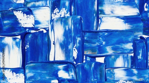 Abstract blue paint strokes on canvas with bold textured patterns.