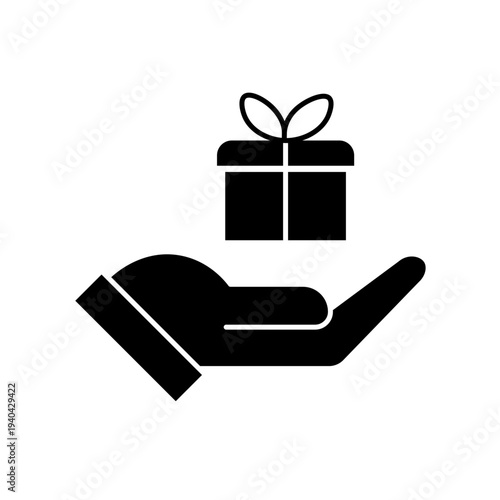 Vector art illustration of a hand holding a neatly wrapped gift box with a red bow on top. Hand gift con vector silhouette on white background. Silhouette of a hand holding a gift box with ribbon.
