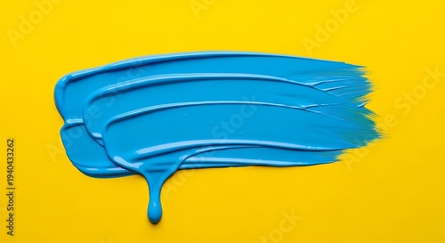 Vibrant blue paint smear on yellow.
